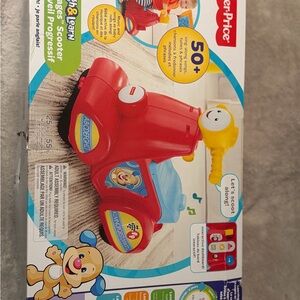 Fisher-Price Red Ride-On Learning Scooter with Yellow Handle and Blue Seat